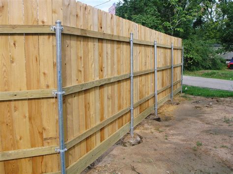 replace metal house post with wood|metal fence posts to wood.